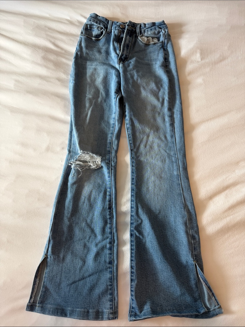 Distressed Blue Flare Jeans with Side Slits